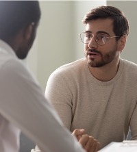 Man discussing issues of depression with Peoria Therapists
