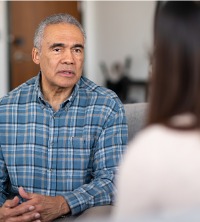 An elderly man speaking with a therapist during General Counseling in East Peoria IL