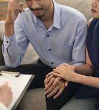A couple talking with Marriage Counselors Near You